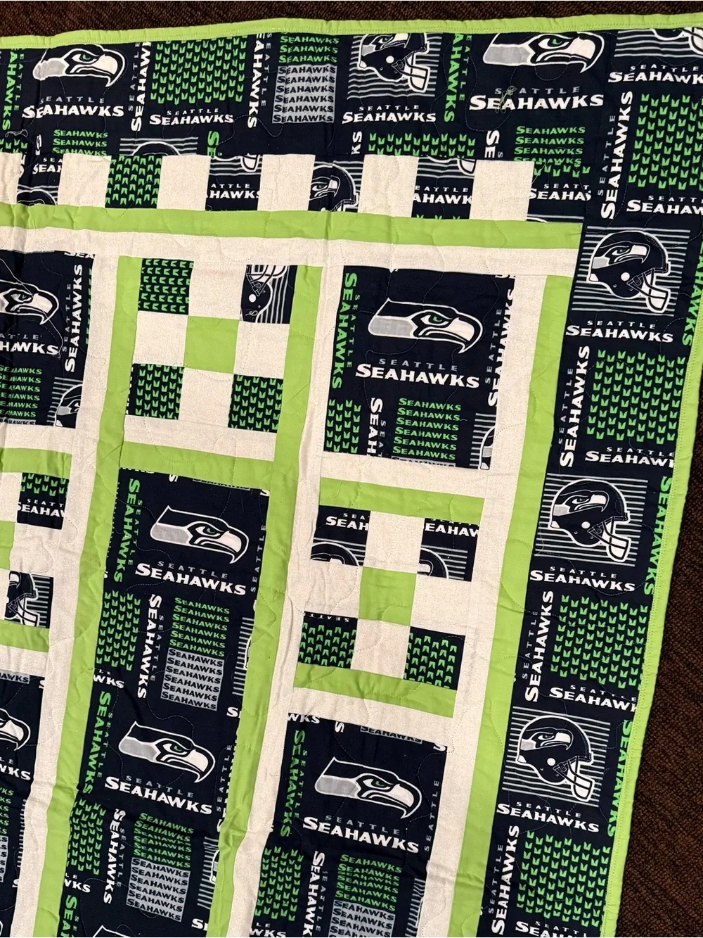 A beautifully crafted, one‑of‑a‑kind handmade throw featuring four detailed trai